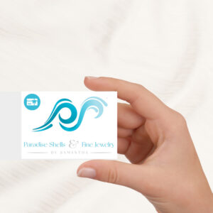 hand holding a Pardise Shells & Fine Jewelry gift card