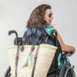 French Market Basket Backpack in Natural/Black on Samantha's wheelchair